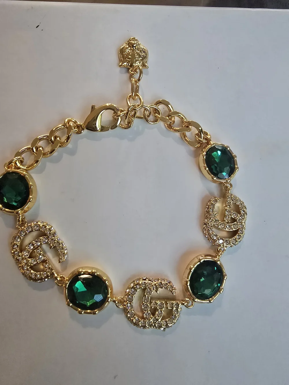 Gucci 18kgp GG Gold-Tone Bracelet with Emerald Green Crystal Accents